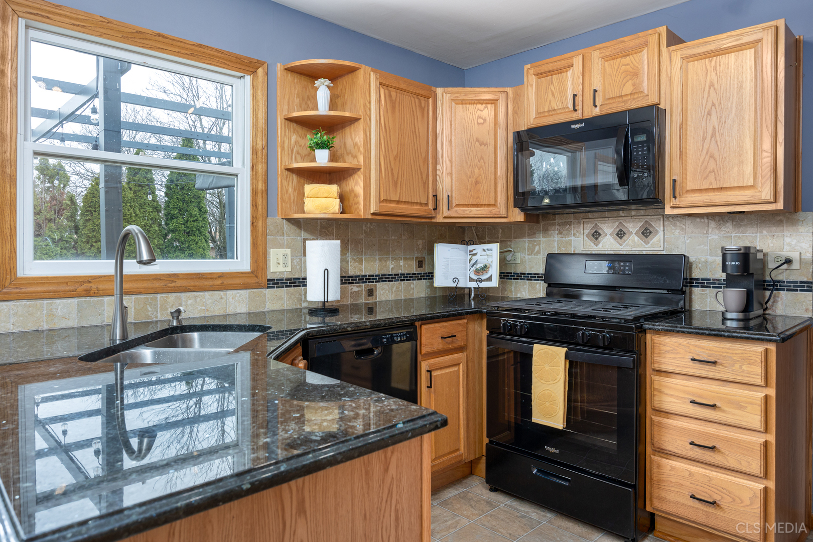 2115 Tiffany Drive Schaumburg, IL 60193 - Photo 8 of 23 a kitchen with stainless steel appliances granite countertop a sink stove and microwave