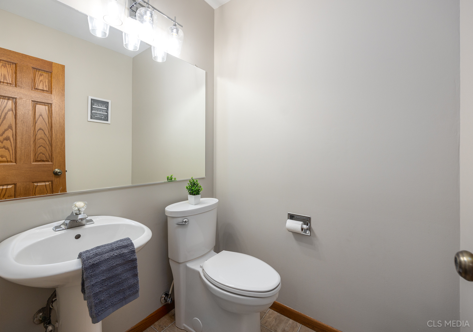 2115 Tiffany Drive Schaumburg, IL 60193 - Photo 10 of 23 a bathroom with a sink mirror and toilet