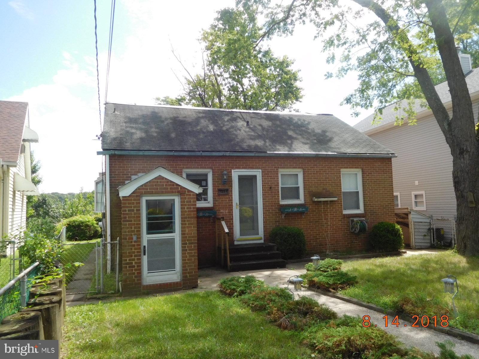 1234 Hillside Road Pasadena, MD 21122 - Photo 1 of 12 a front view of a house with garden