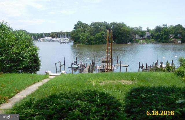 1234 Hillside Road Pasadena, MD 21122 - Photo 11 of 12 a view of a lake with houses in the back