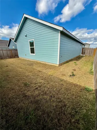 a house view with a backyard space