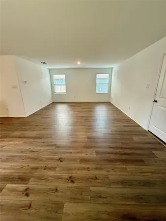a view of room and hardwood floor