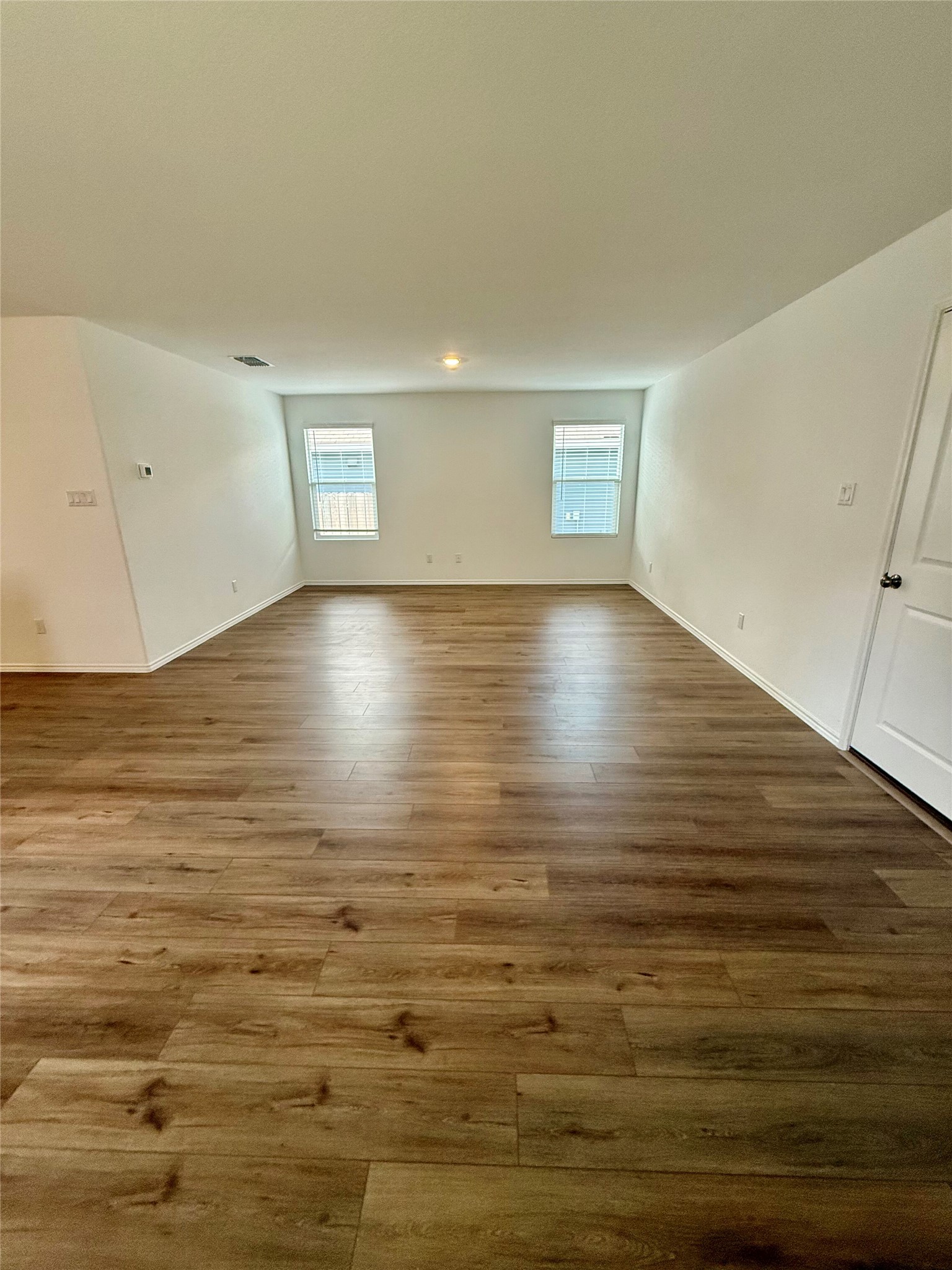 716 Commander Abbott Drive Jarrell, TX 76537 - Photo 6 of 17 a view of room and hardwood floor