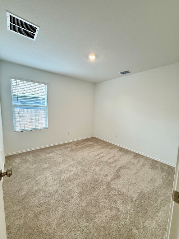 716 Commander Abbott Drive Jarrell, TX 76537 - Photo 9 of 17 an empty room with a workbench