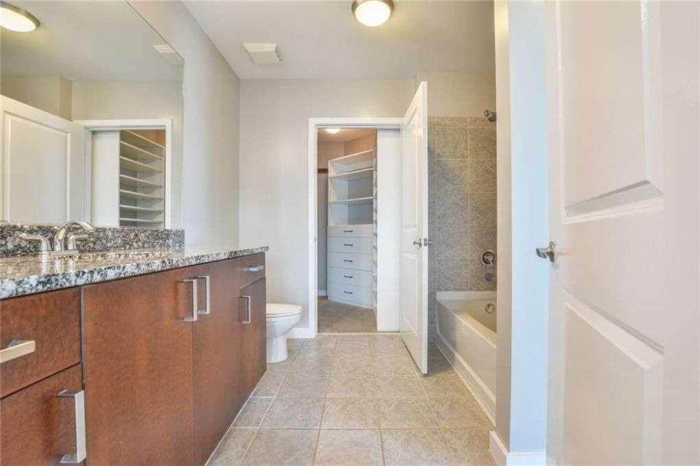 250 Pharr Road Northeast, Unit 2002 Atlanta, GA 30305 - Photo 4 of 13 a view of bathroom with tub shower and sink