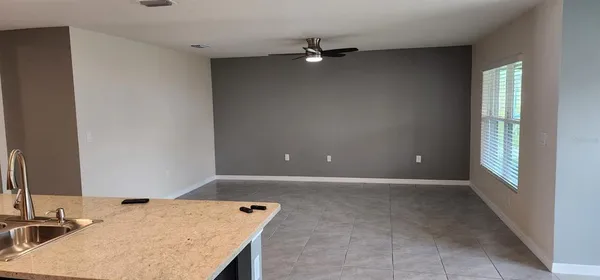 a view of a kitchen cabinets and a stove