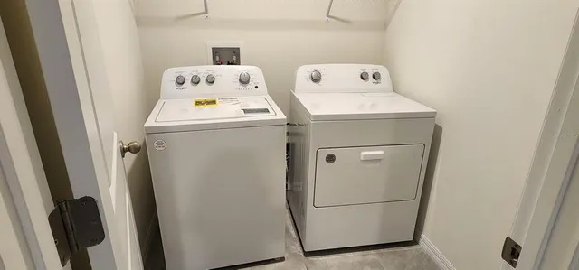 a utility room with dryer and washer