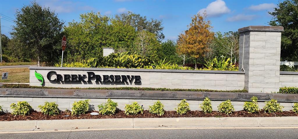 16778 Carlton Pond Street Wimauma, FL 33598 - Photo 2 of 27 a view of a sign board with street