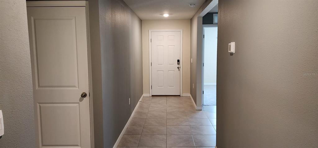 16778 Carlton Pond Street Wimauma, FL 33598 - Photo 25 of 27 a view of a hallway with a elevator
