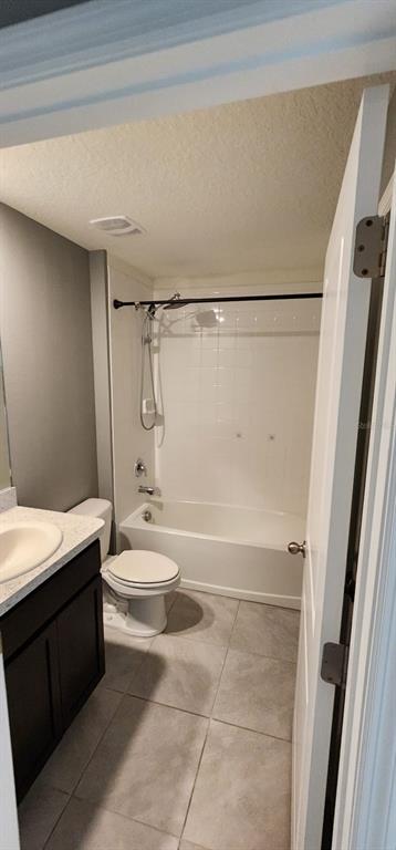 16778 Carlton Pond Street Wimauma, FL 33598 - Photo 27 of 27 a bathroom with a granite countertop shower toilet and sink