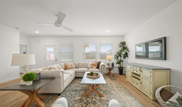 a living room with furniture and a large window