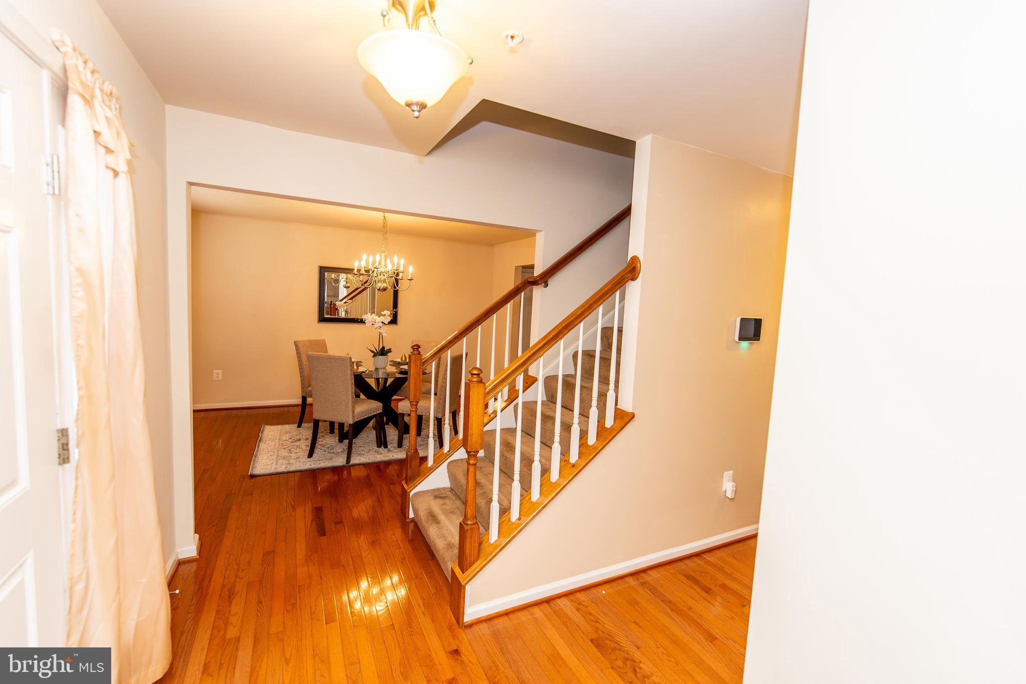 13400 Oaklands Manor Drive Laurel, MD 20708 - Photo 13 of 44 a view of a hallway with wooden floor