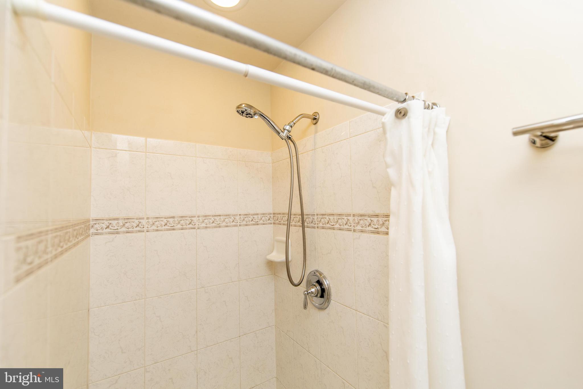 13400 Oaklands Manor Drive Laurel, MD 20708 - Photo 17 of 44 a bathroom with a shower