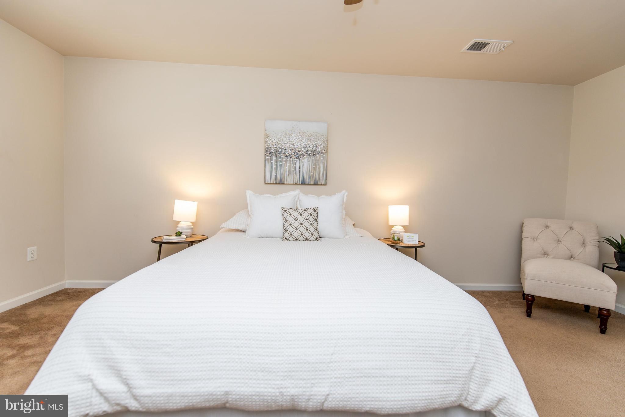 13400 Oaklands Manor Drive Laurel, MD 20708 - Photo 19 of 44 a bedroom with a bed and a couch