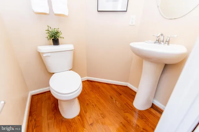 a view of staircase with wooden floor and a window
