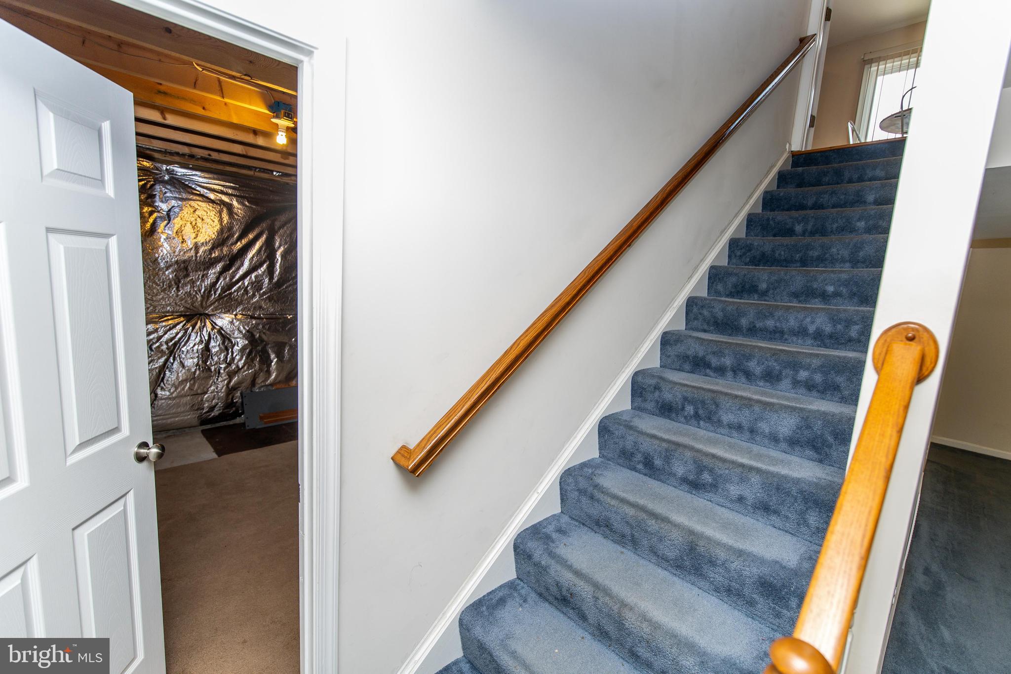 13400 Oaklands Manor Drive Laurel, MD 20708 - Photo 31 of 44 a view of staircase with wooden floor and a window