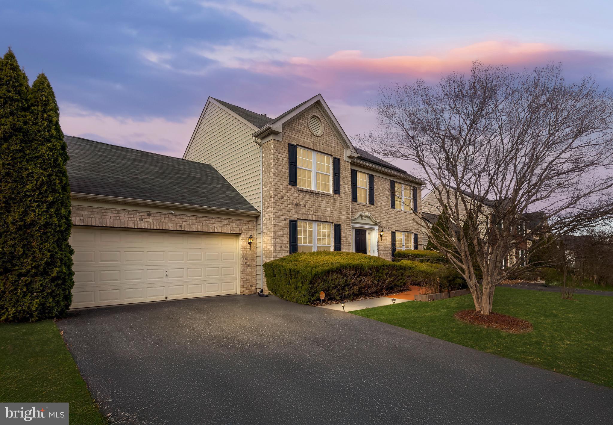 13400 Oaklands Manor Drive Laurel, MD 20708 - Photo 44 of 44 a front view of a house with a garden
