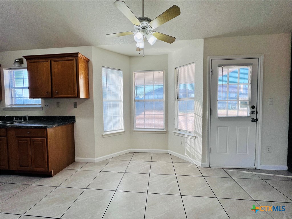 1704 Boydstun Loop Killeen, TX 76542 - Photo 4 of 11 a view of an empty room with kitchen and a window