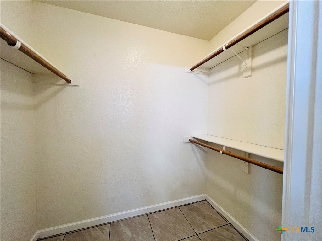 1704 Boydstun Loop Killeen, TX 76542 - Photo 8 of 11 a view of a room with racks on the wall