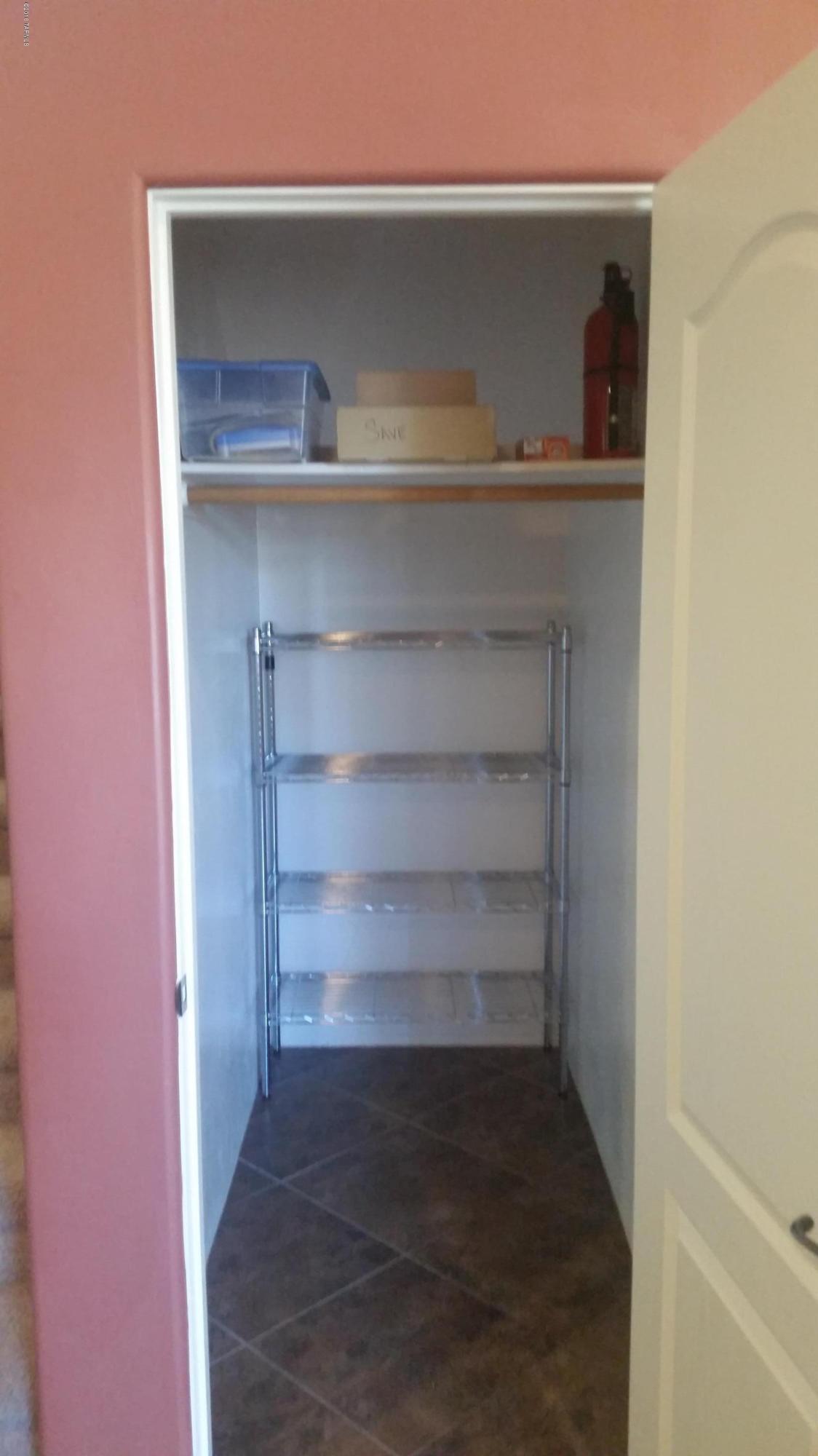 478 East Cedarvale Road Tucson, AZ 85704 - Photo 15 of 39 a view of storage and utility room with empty racks