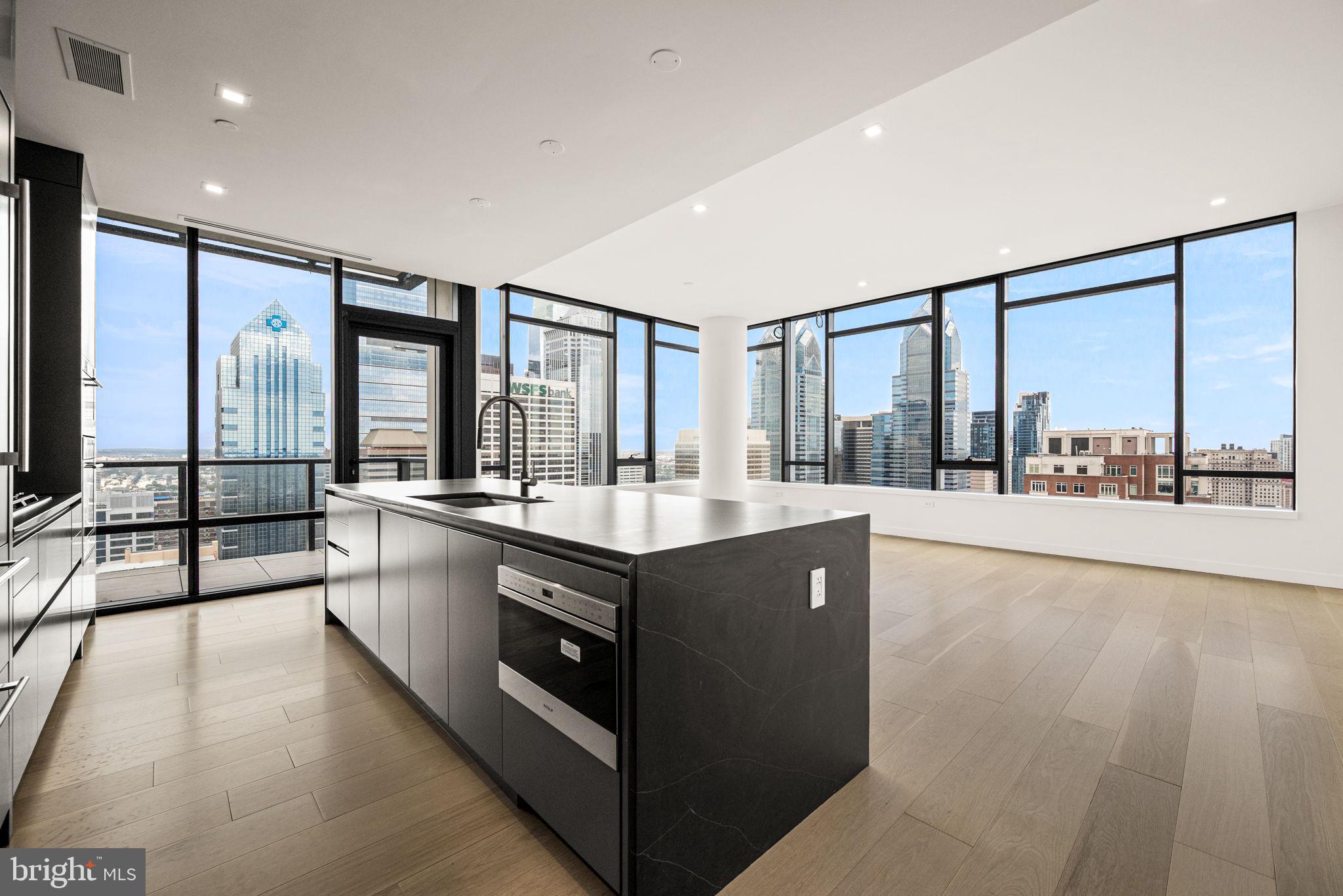 1911 Walnut Street, Unit 3404 Philadelphia, PA 19103 - Photo 2 of 37 a kitchen with stainless steel appliances granite countertop a sink and a large window