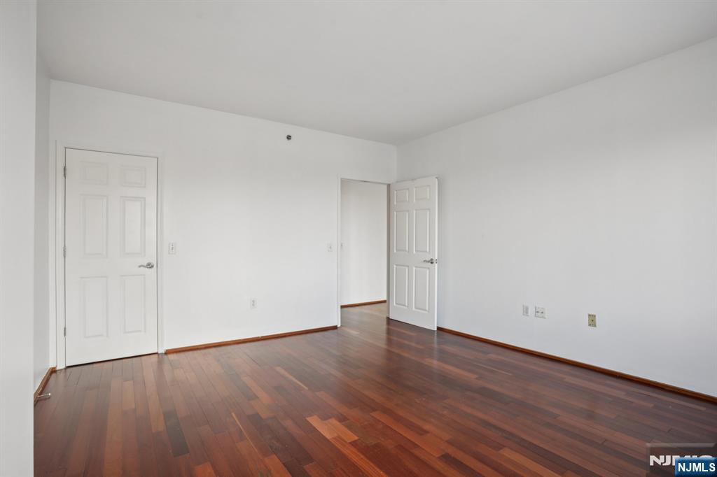 3110 City Place Edgewater, NJ 07020 - Photo 25 of 36 a view of an empty room with wooden floor