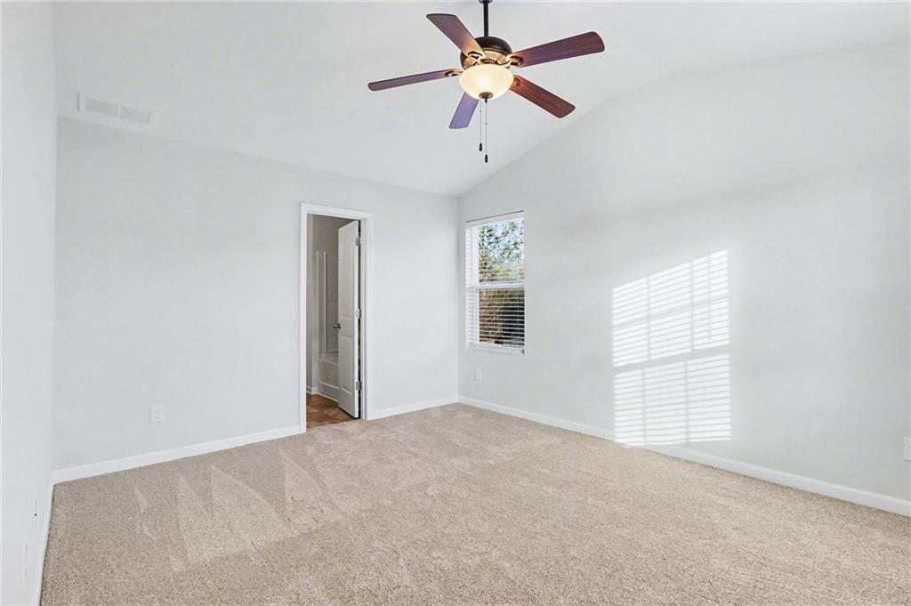 1235 To Lani Path Stone Mountain, GA 30083 - Photo 15 of 33 wooden floor in an empty room with a window