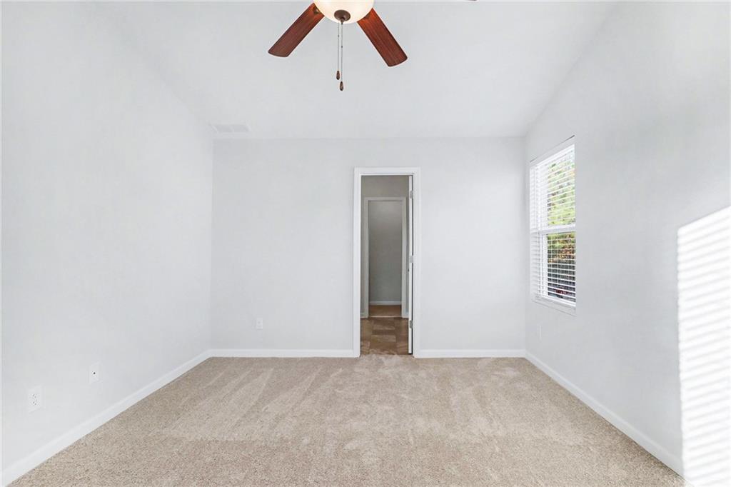 1235 To Lani Path Stone Mountain, GA 30083 - Photo 16 of 33 an empty room with a window