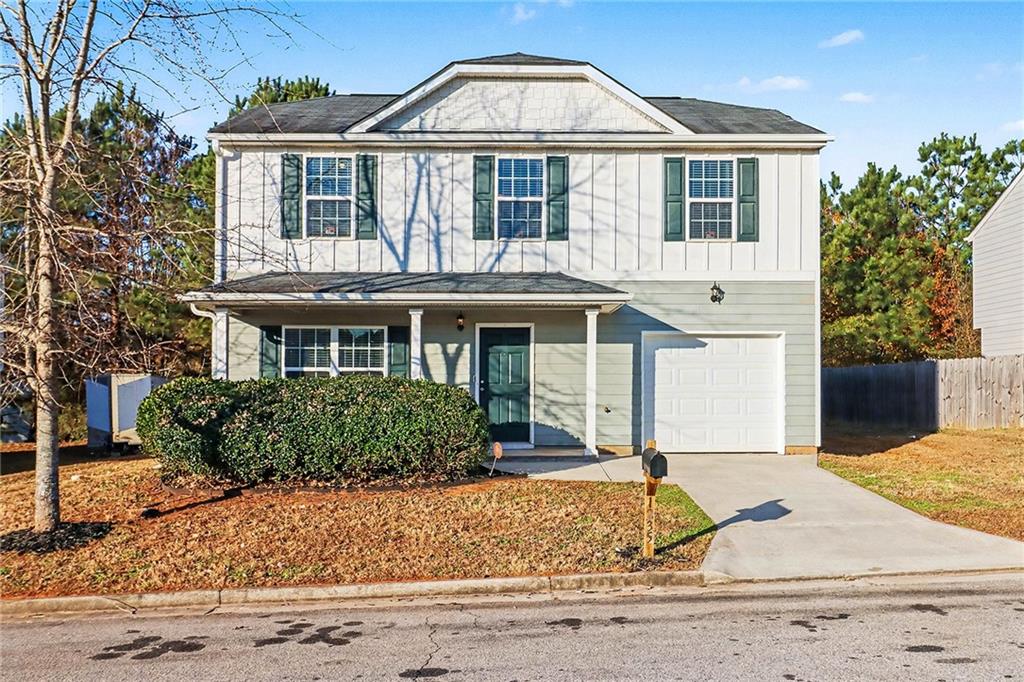 1235 To Lani Path Stone Mountain, GA 30083 - Photo 2 of 33 a front view of a house with garden