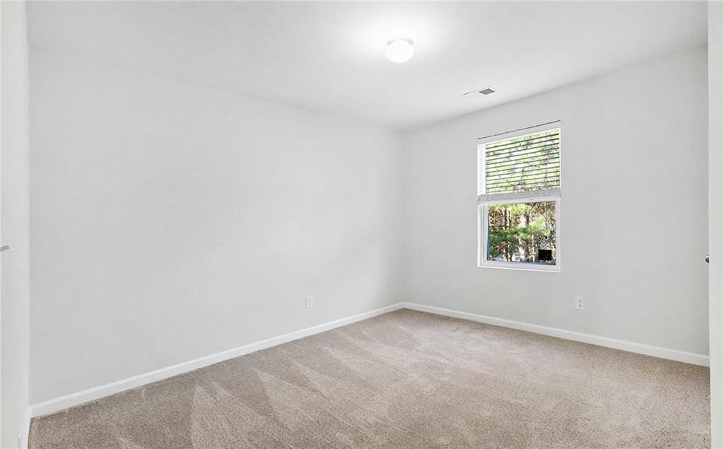 1235 To Lani Path Stone Mountain, GA 30083 - Photo 22 of 33 an empty room with a window