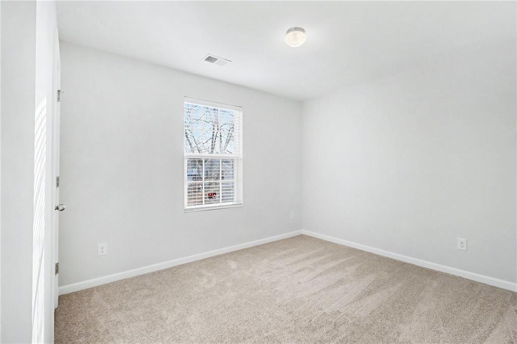 1235 To Lani Path Stone Mountain, GA 30083 - Photo 23 of 33 an empty room with a window