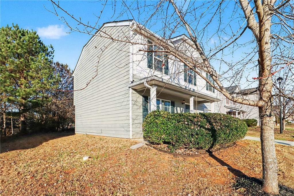 1235 To Lani Path Stone Mountain, GA 30083 - Photo 33 of 33 a view of a white house with a large tree