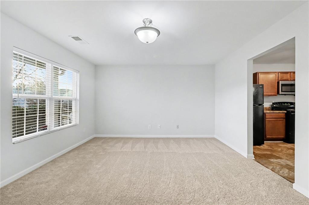 1235 To Lani Path Stone Mountain, GA 30083 - Photo 9 of 33 a view of an empty room with a window