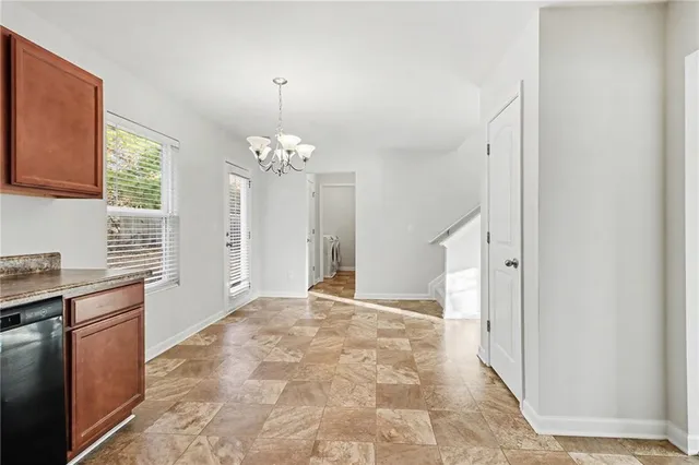 a view of a kitchen with granite countertop cabinets and a stove