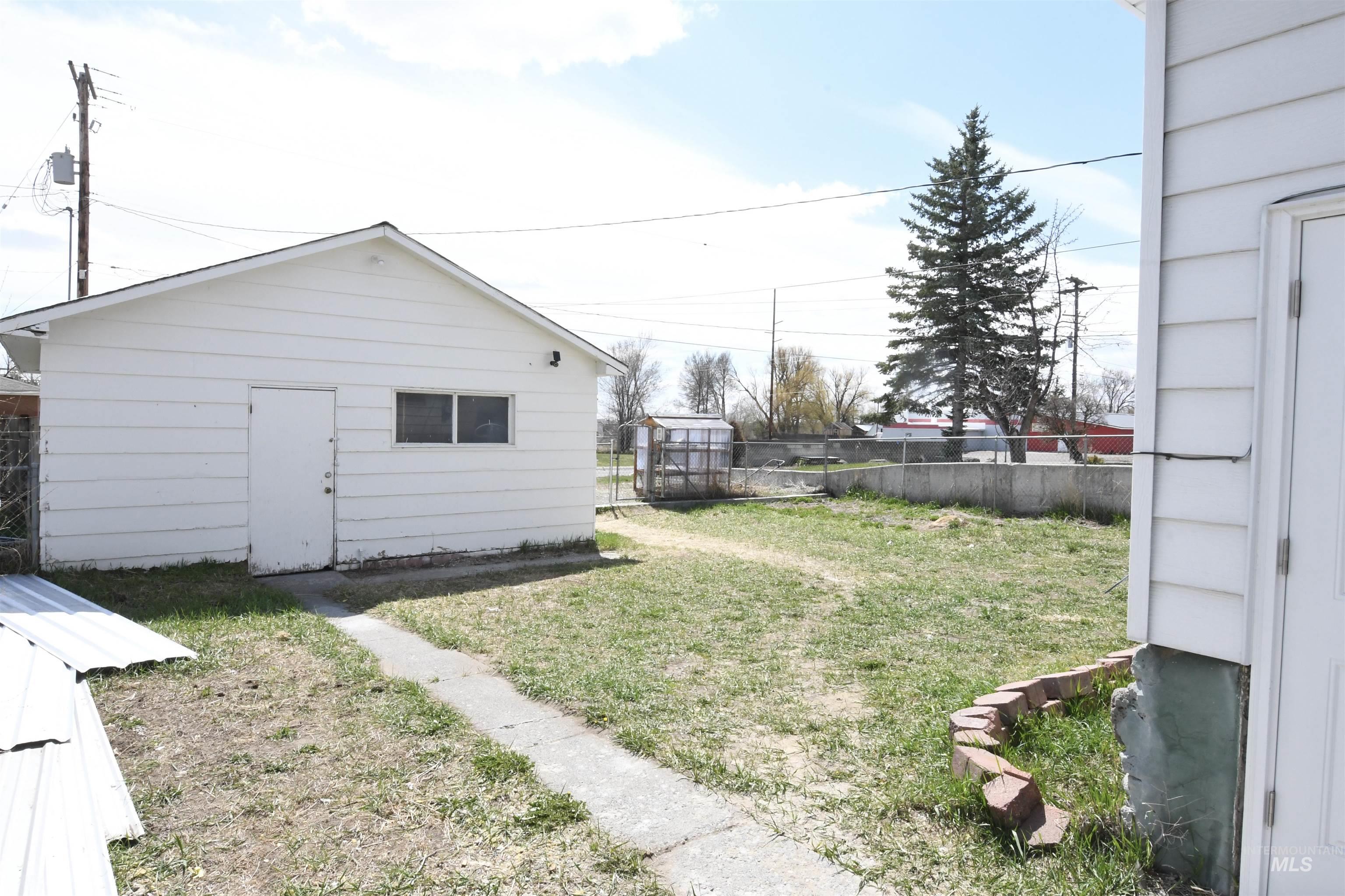 238 West Main Street St. Anthony, ID 83445 - Photo 3 of 9 View of yard featuring an outbuilding