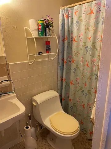 a bathroom with a sink and toilet