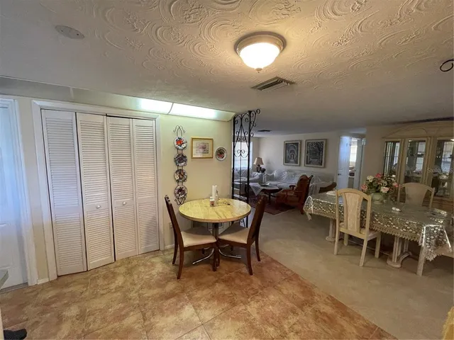 a living room with lots of furniture and a window