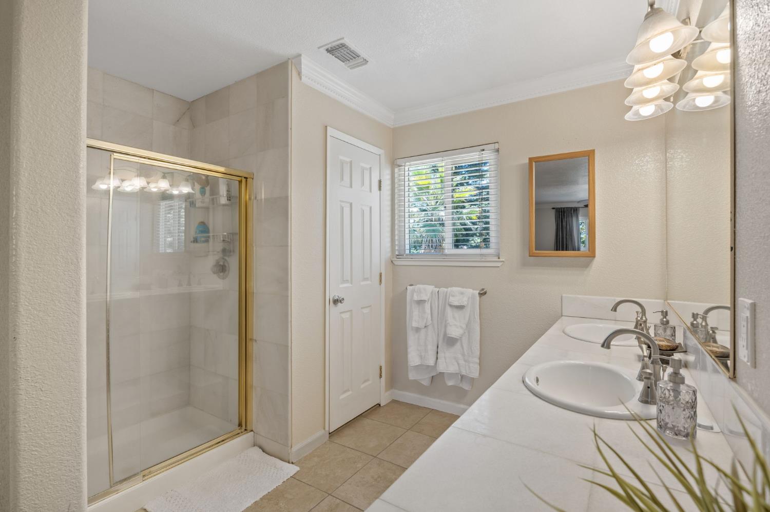 4206 Zephyr Way Sacramento, CA 95821 - Photo 27 of 45 a bathroom with a sink and a mirror