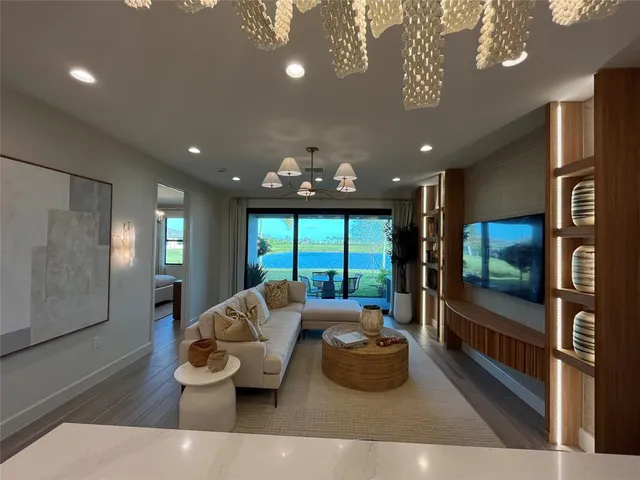 a dining room with furniture and wooden floor