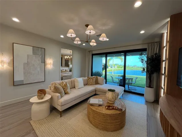 a bedroom with a bed window and couch