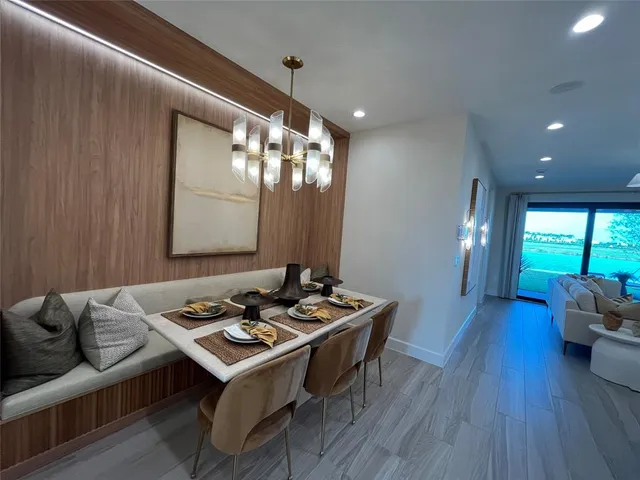 a bathroom with a granite countertop double vanity sink and a mirror