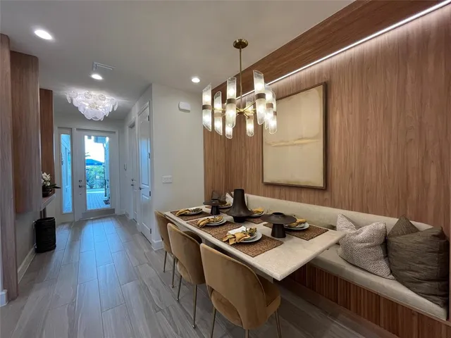 a bathroom with a granite countertop sink a vanity and a large mirror