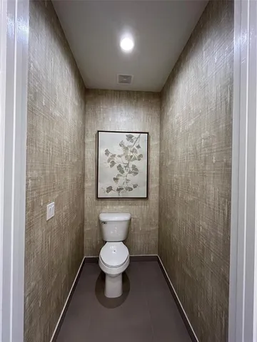 a bathroom with a bathtub and toilet