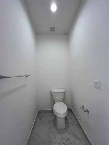 a bathroom with a sink a mirror and a toilet