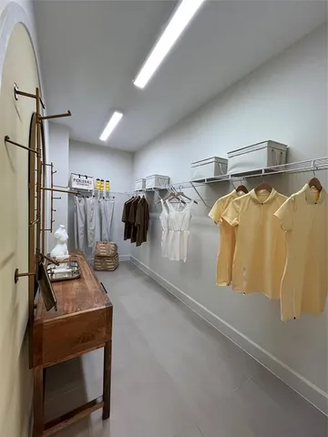 a bathroom with a granite countertop toilet and a sink