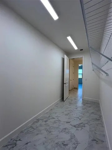 a utility room with cabinets washer and dryer