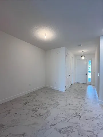 a outdoor living room with furniture and a potted plant