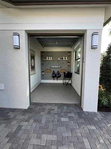 a kitchen with kitchen island a stove a refrigerator and a dining table with wooden floor