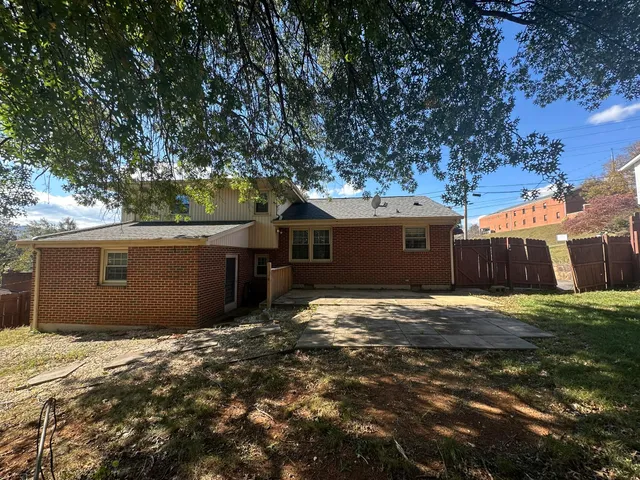 a view of a tree in front of a house