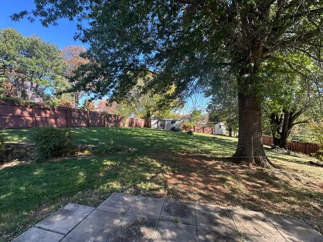 a backyard of a house with lots of green space